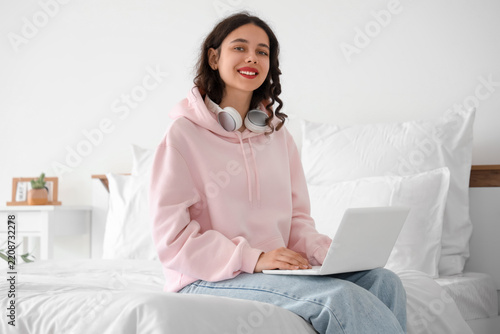 Remote learning and digital education, happy young woman using laptop for onl...