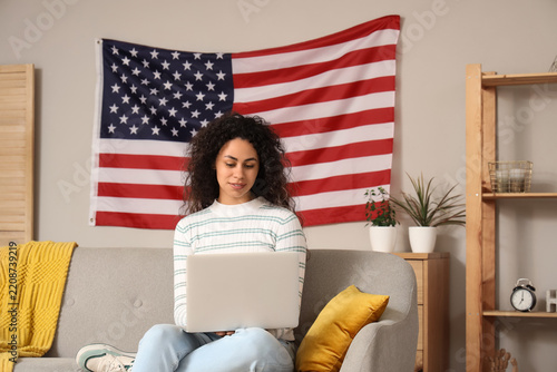 Remote work and american lifestyle, young woman using laptop on sofa at home ...
