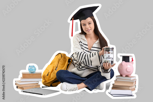 Student debt and college savings, young woman in graduation cap holding money...