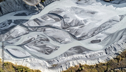 Abstract icy marble texture with flowing silver and white waves.