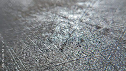 Dark cosmic stone texture with chaotic silver scratches and reflections. Abstract metallic background, magical marble backdrop, artistic material pattern.