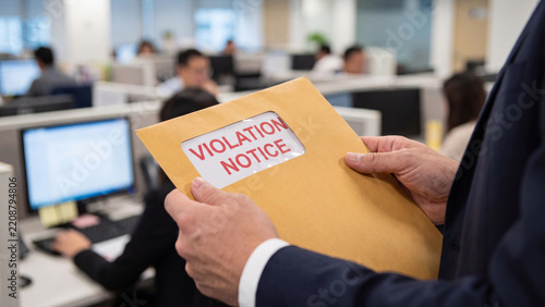 Violation notice document concept showing workplace disciplinary letter for compliance breach and corporate policy enforcement