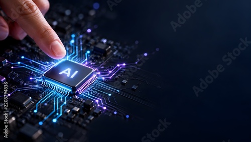 Human finger activating glowing artificial intelligence microchip on futuristic computer circuit board