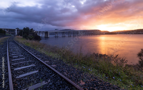 Tasman Bridge at sunrise, with Southern Line railway in foreground