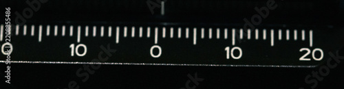 Straight Ruler Showing Clear Numerical Graduation Marks Against a Plain Dark Background