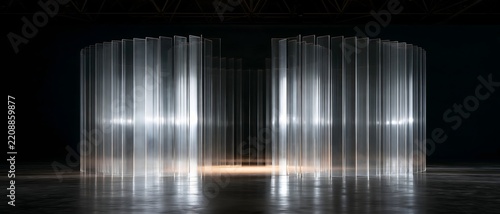 Contemporary curved glass entrance with luminous vertical panels in dark exhibition hall, creating futuristic architectural installation with reflective flooring and dramatic illumination