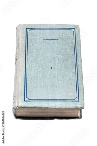 Well-worn, blue cloth-covered book with a simple decorative border, resting closed on its spine. The aged texture suggests a history of use.