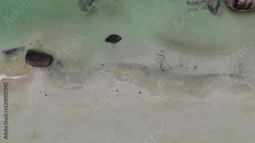 Top view of beautiful turquoise sea and wave on the beach in sunny day. Natural background