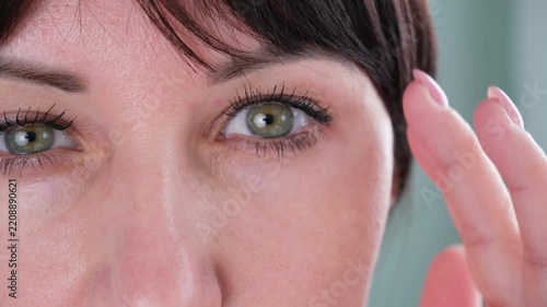The woman has a drooping eyelid
