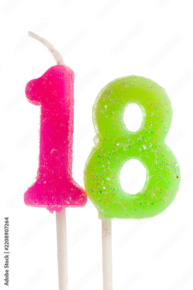 Fototapeta premium Eighteen birthday candles in pink and green for celebrating a special milestone