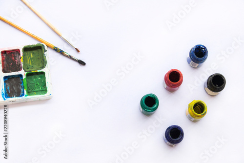 paints, brush and palette drawing of lifestyle arrangement flat lay style on background white