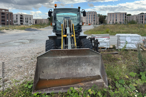 Construction loader at a building site in progress