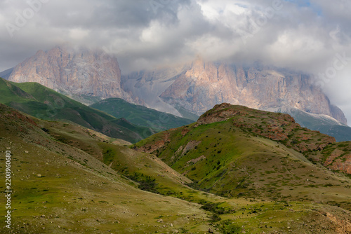 The green slopes and rocky summits of the Caucasus Mountains in Chegem Gorge