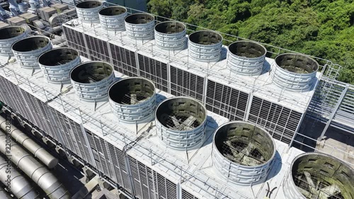 Industrial cooling towers on top of modern data center building.