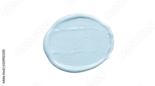 Fotografie A single isolated smear of light blue acrylic paint on black background