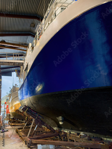 Fishing vessels undergoing maintenance at a shipyard in Ballstad, Lofoten, Norway