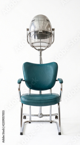 Vintage beauty salon hair dryer chair isolated on a clean white background, retro hairdressing station equipment symbolizing classic hair care and nostalgia, minimalist style