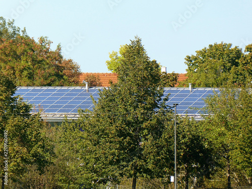 Photovoltaic energy: solar panels on a roof in a sunny day