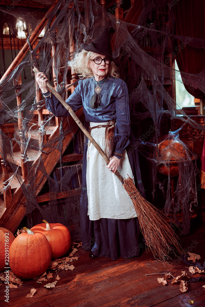 Obraz premium Senior Witch with Broom