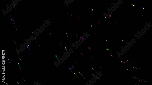 Abstract colorful light particles moving in a dark seamless loop background