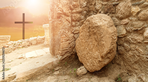 Empty Tomb of Jesus with Rolled Stone and Three Crosses at Sunrise