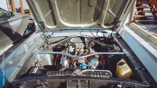 Vintage V8 Engine Bay of a Classic American Muscle Car with Open Hood