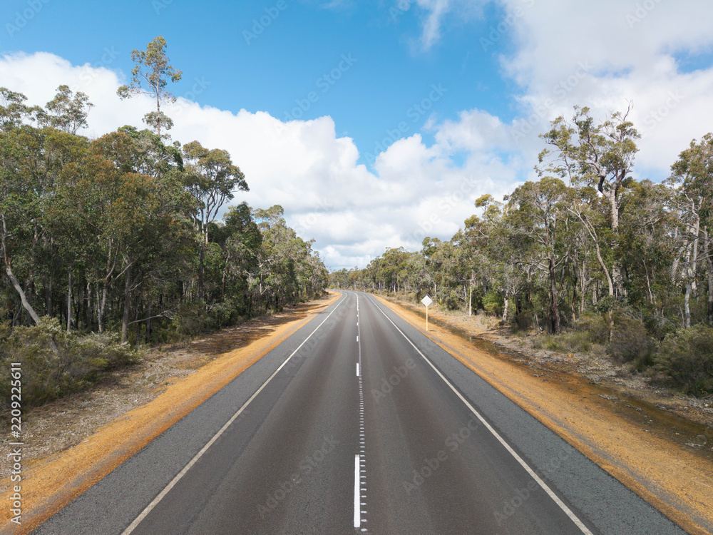 Fototapeta premium Aerial view of a rural road through bushland on Kangaroo Island, South Australia