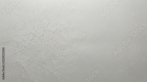 Cracked plaster texture displays a network of fissures on a neutral gray surface fractured wall damage deterioration aging decay worn roughness concrete stucco coating finish