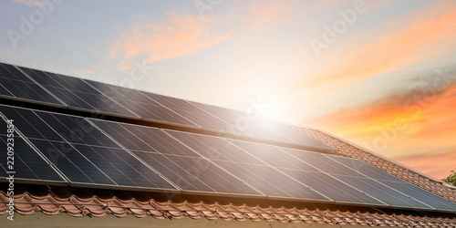 Obraz na plátně Photovoltaic solar power panel on blue sky ,green clean alternative energy