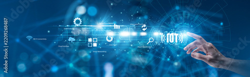 Connected Systems. Network administrator pointing the hand at glowing smart device ecosystem and sensor telemetry interface. Hardware integration and internet of things.