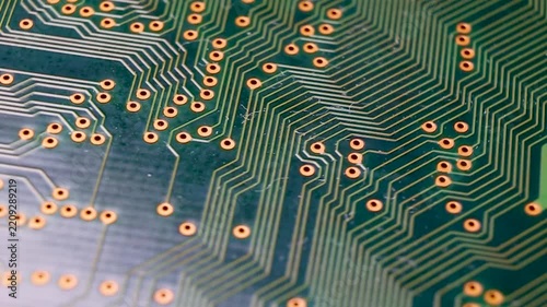 Close-up view of a part of an electronic printed circuit board, macro video shooting