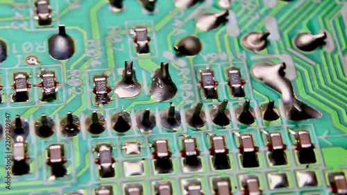 Part of an electronic printed circuit board with electronic components, video macro shooting
