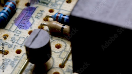 Part of an electronic printed circuit board with electronic components, video macro shooting