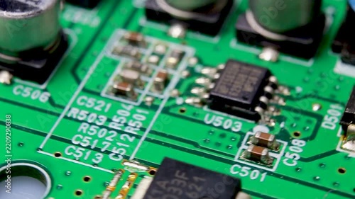 Part of an electronic printed circuit board with electronic components, video macro shooting