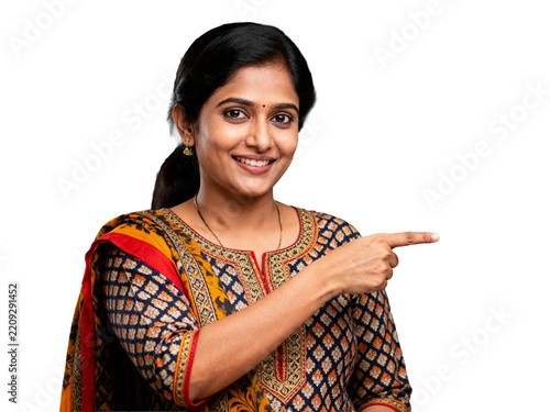 Isolated smiling Indian woman, goldenrod and navy patterned salwar kameez, pointing right, welcoming gesture on transparent background