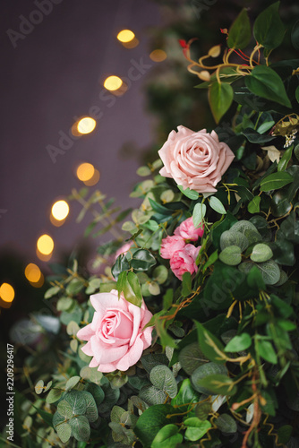 Stylish interior bouquet in pink tones from garden flowers and eucalyptus