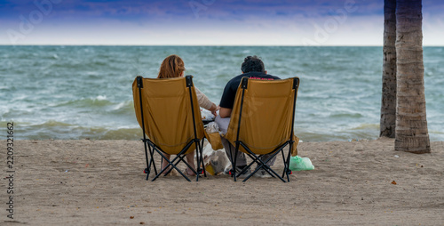 Tourists relax on beach in Thailand