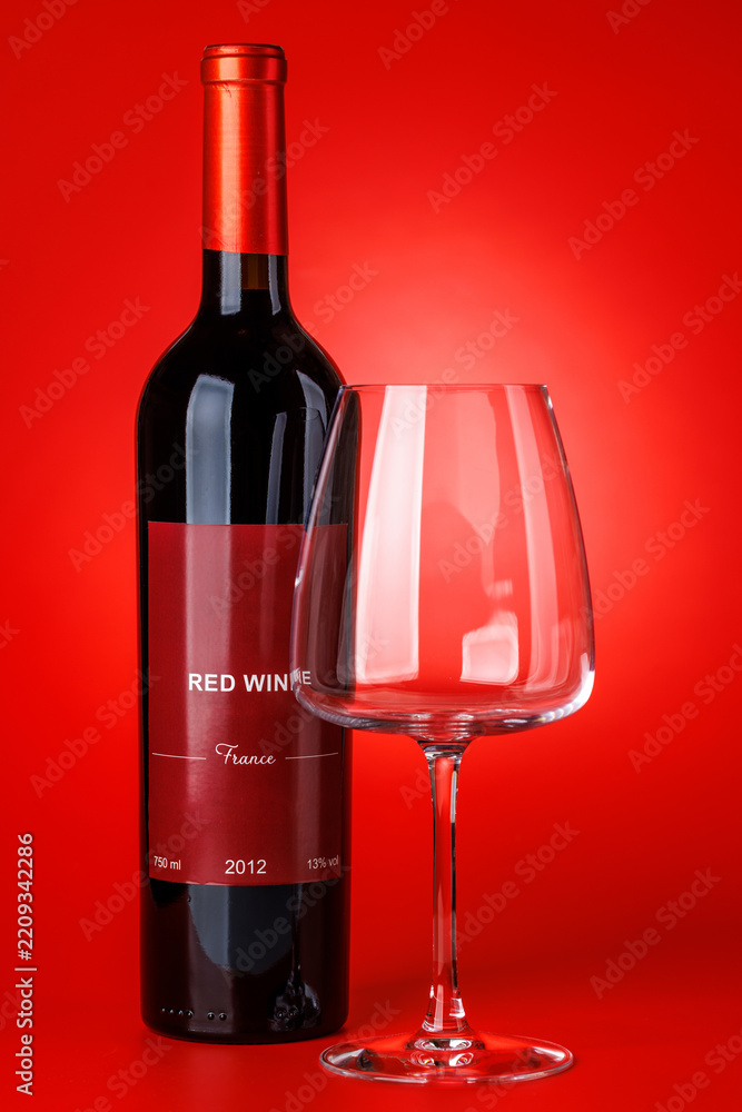 Obraz premium Red wine bottle mockup on red background