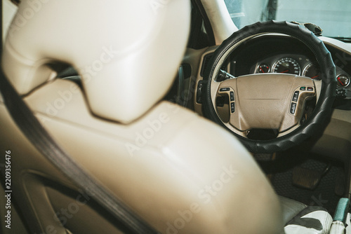 Car interior with steering wheel and dashboard