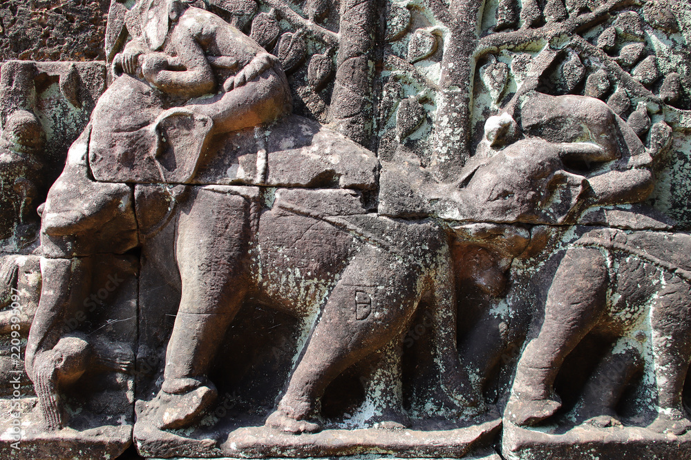 Fototapeta premium sculpted terrace in a ruined khmer hindu and buddhist complex (angkor thom) in angkor in siem reap in cambodia 