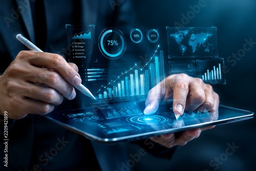 Business professional analyzing digital data on interactive tablet screen with charts