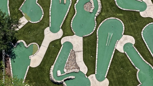 Aerial view of the miniature golf course at Windward Ranch Boulevard with green artificial turf, concrete pathways, and stone obstacles in St. Johns County, Florida, United States.
