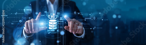 Analyst hands touch complex, glowing Big Data statistical network dashboards interpreting massive information. Advanced processing software uncovers a hidden, actionable business insight.