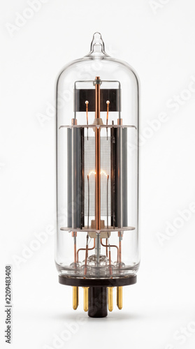 Vertical studio photograph of a retro electronic glass vacuum tube radio valve isolated against a clean white background.