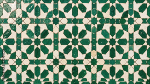 Traditional Moroccan zellij ceramic tile pattern with green and white Islamic geometric stars   