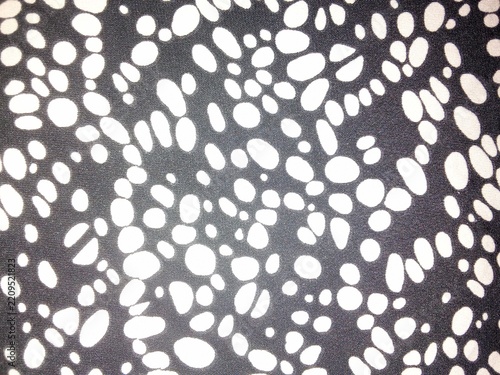 High contrast black and white abstract spotted fabric texture with abstract background material wallpaper monochrome artistic creative clothing decorative backdrop