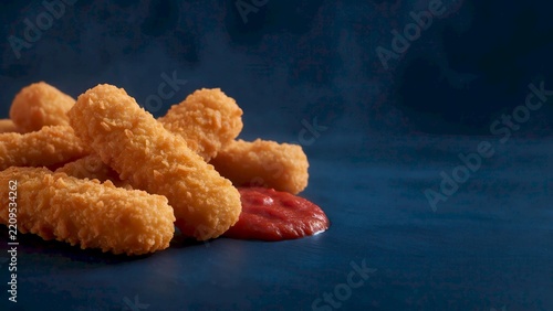 Crispy Breaded Chicken Strips with Ketchup on Dark Blue, AI Generated