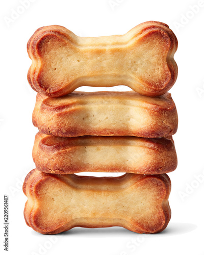 Four crunchy bone shaped dog biscuits stacked vertically on a white background with dog biscuit pet treat crunchy snack dog food animal care pet diet