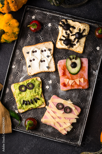Halloween food for children. Funny scary monsters toasts