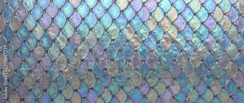 Mermaid iridescent scale texture background. Holographic metallic fish scales pattern. Colorful shiny fantasy surface